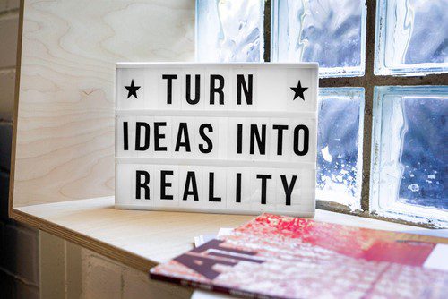 Sign in front of a window saying Turn Ideas into reality