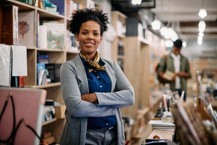Confident black woman business owner, happy to have easily applied for a small business loan