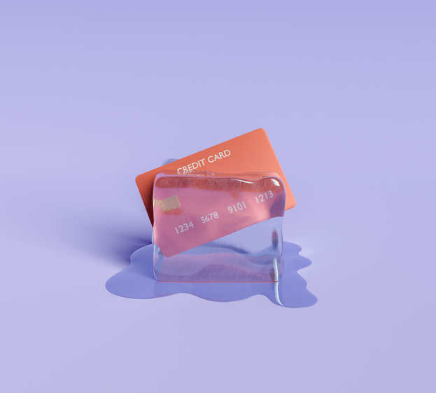 Credit card frozen in a block of ice, representing credit freeze