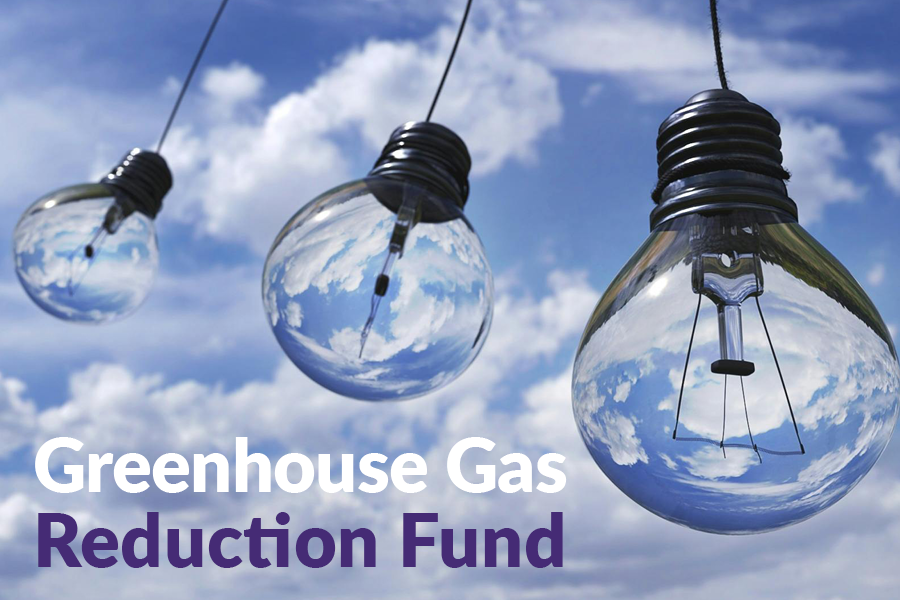 Lightbulbs against a blue sky with text "Greenhouse Gas Reduction Fund"