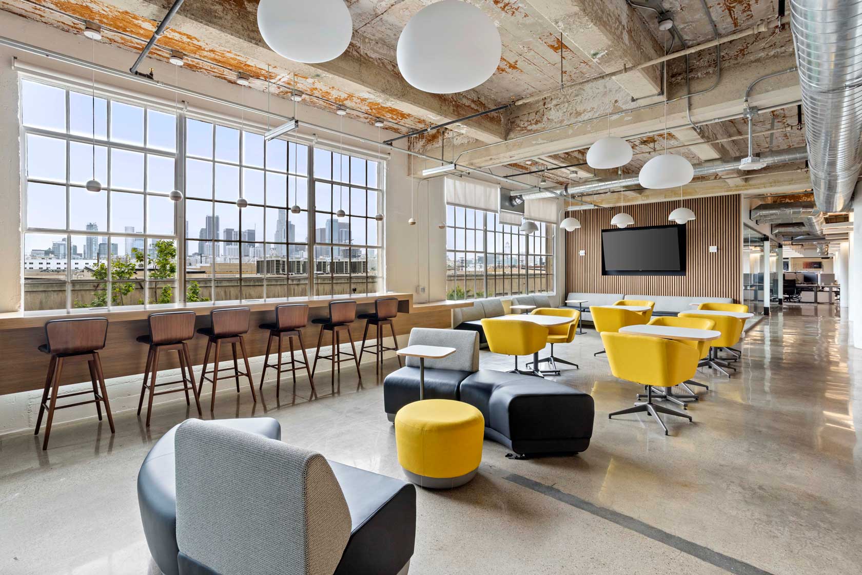 LA office seating area with view of city.