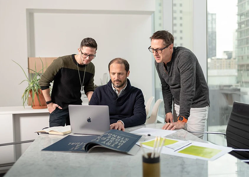 Team from small business Upshift Creative working together