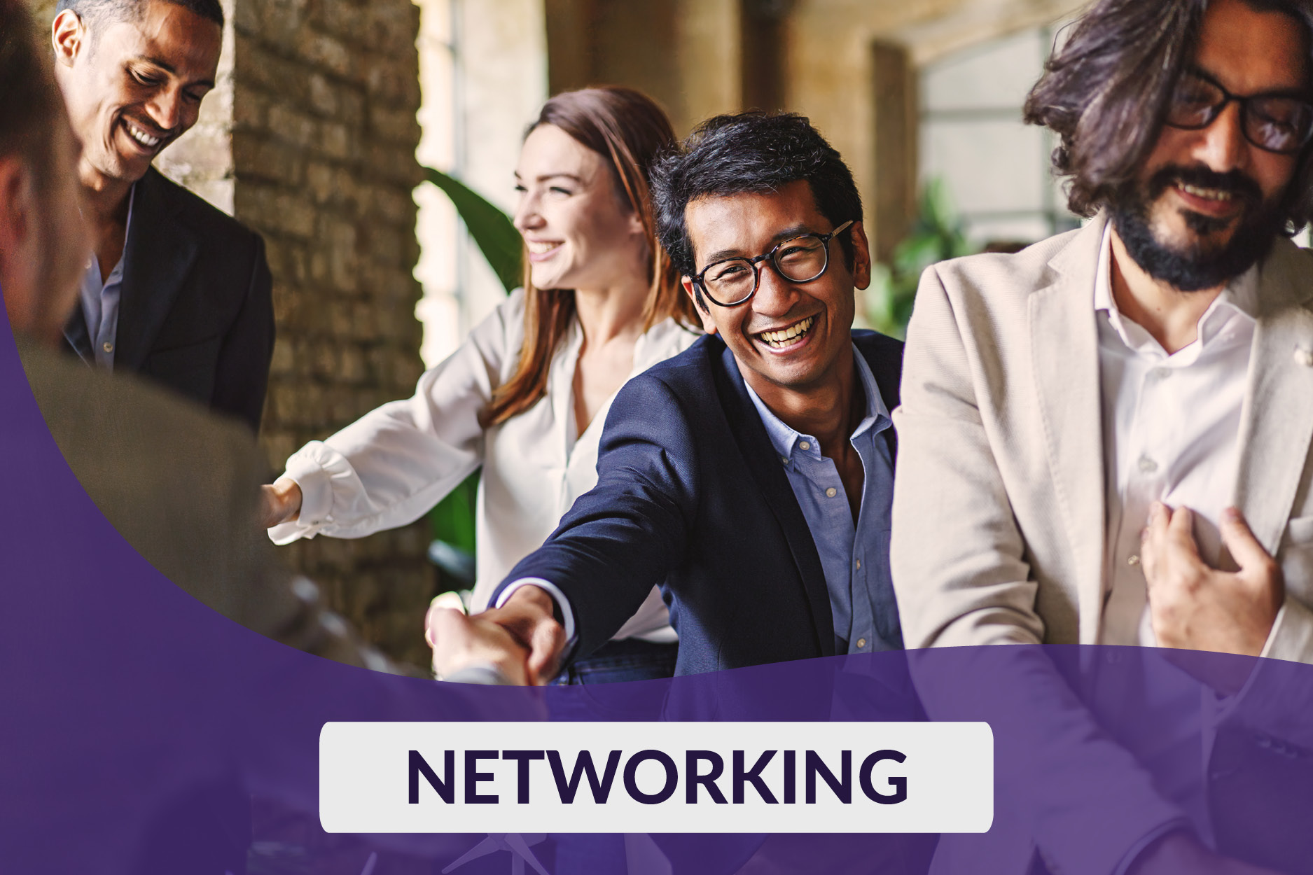 Diverse group of business owners shaking hands and networking