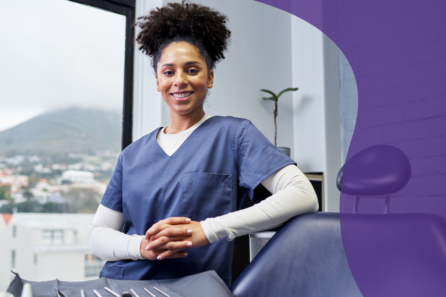 Dentist smiling in her office considering small business loan options