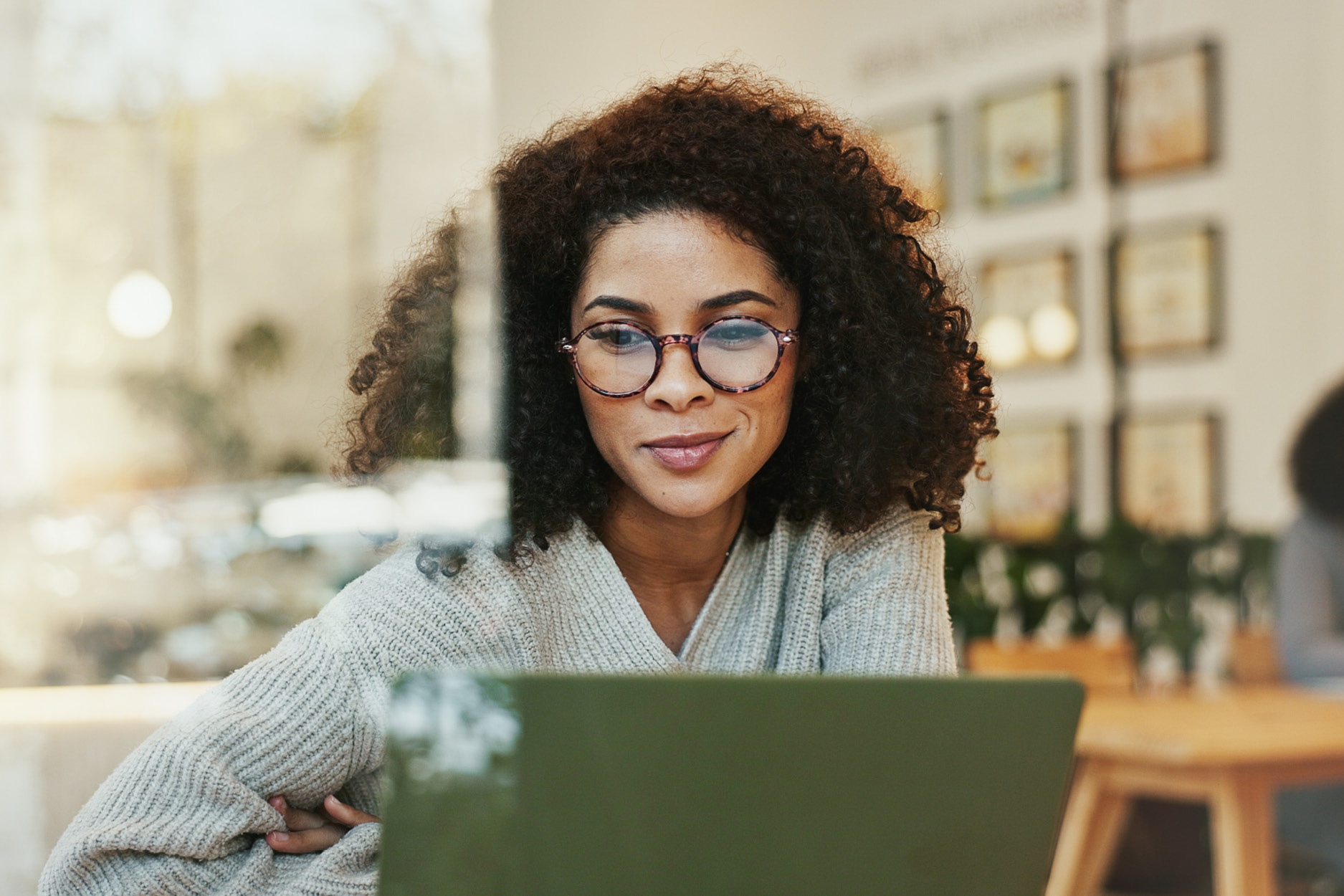 Successful business owner looking at their website with pride