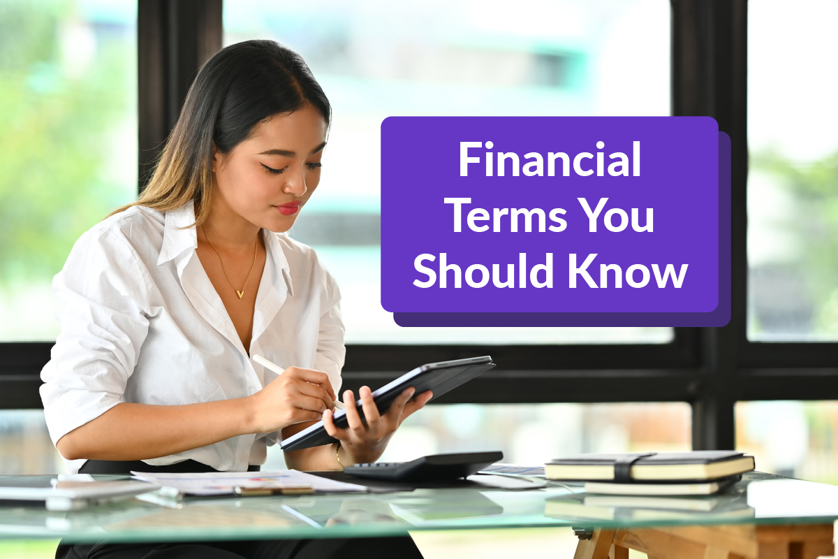 Millennial business owner reviewing 14 financial terms common in small business lending