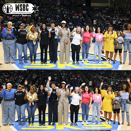 Group photo of WSBC (Women's Small Business Cohort) at center court at the Chicago Sky game